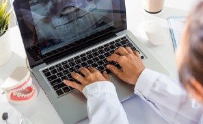 a dentist working on digital impressions